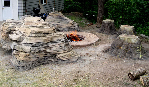 Faux-Rock-Fire-Pit-Lounge-with-fake-tree